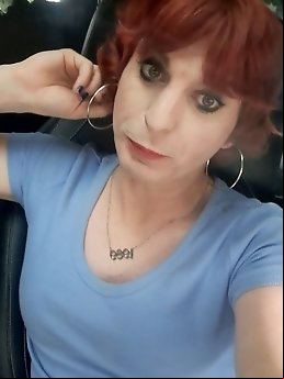 Kellycd2022, the amateur crossdresser, flaunts her seductive charm in a provocative pink bodysuit.